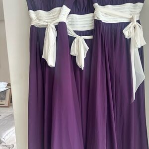 3 plum bridesmaid gowns. Ivory bodice ties. Wired strapless bodice.